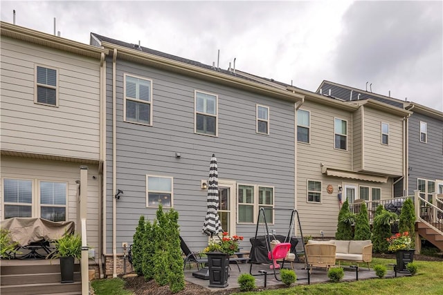 2005 Lampl Ln, Penn Twp Wml, PA 15644 - back of property with outdoor lounge area and a patio