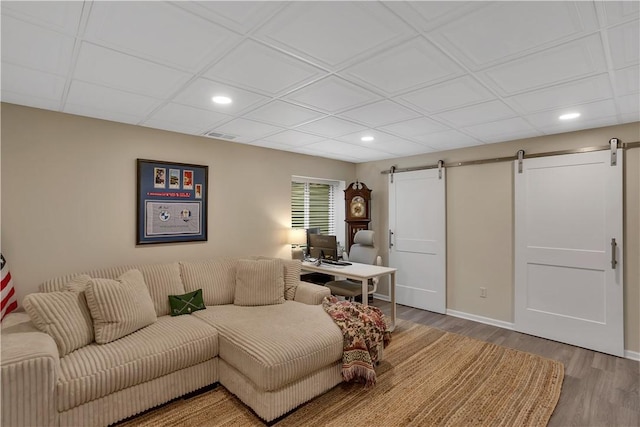 2005 Lampl Ln, Penn Twp Wml, PA 15644 - living room with a barn door, recessed lighting, wood finished floors, and a desk