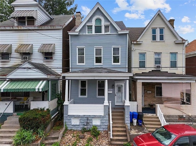 3103 Shadeland Ave, Brighton Heights, PA 15212 - townhome / multi-family property featuring a chimney, a porch, and stairs