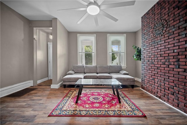 3103 Shadeland Ave, Brighton Heights, PA 15212 - living area with a ceiling fan, wood finished floors, and brick wall