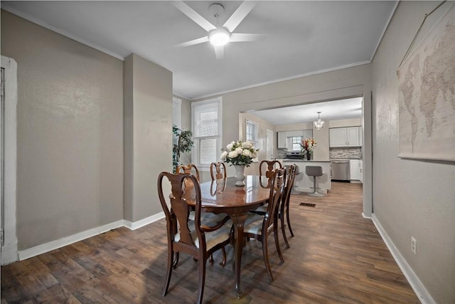 3103 Shadeland Ave, Brighton Heights, PA 15212 - dining area with crown molding, dark wood-type flooring, a ceiling fan, and a chandelier