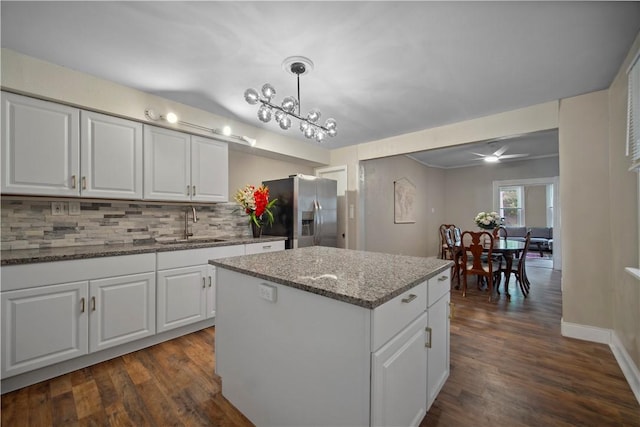 3103 Shadeland Ave, Brighton Heights, PA 15212 - kitchen featuring stainless steel refrigerator with ice dispenser, dark wood finished floors, tasteful backsplash, and a kitchen island