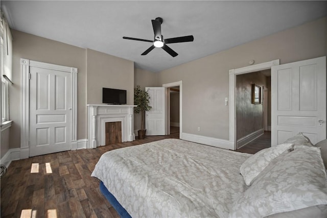 3103 Shadeland Ave, Brighton Heights, PA 15212 - bedroom featuring dark wood-type flooring, a ceiling fan, and a fireplace
