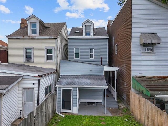 3103 Shadeland Ave, Brighton Heights, PA 15212 - back of property with a fenced backyard, roof with shingles, and a patio