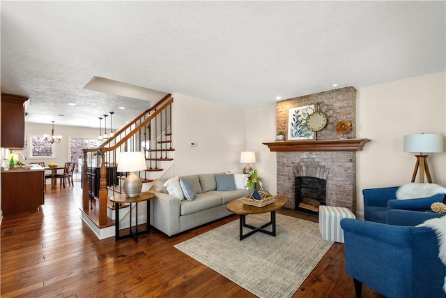 445/447 Georgetown Rd, Cecil, PA 15055 - living area with a chandelier, a fireplace, stairway, dark wood-style floors, and recessed lighting