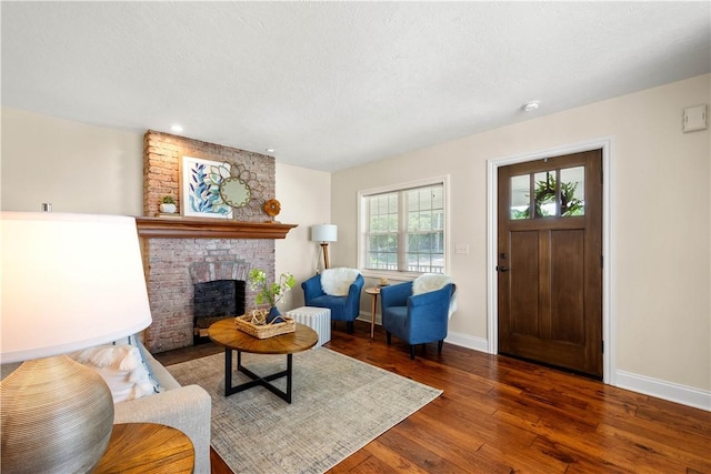 445/447 Georgetown Rd, Cecil, PA 15055 - living area with wood finished floors, a brick fireplace, and recessed lighting
