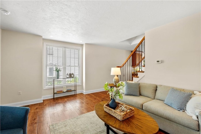 445/447 Georgetown Rd, Cecil, PA 15055 - living room with hardwood / wood-style flooring, stairway, and a textured ceiling