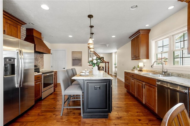 445/447 Georgetown Rd, Cecil, PA 15055 - kitchen featuring stainless steel appliances, a kitchen island, custom range hood, dark wood-style floors, and a kitchen bar