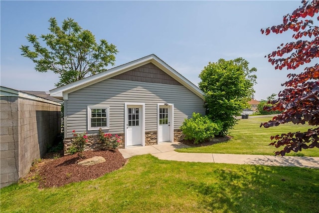 445/447 Georgetown Rd, Cecil, PA 15055 - back of property featuring a lawn and stone siding