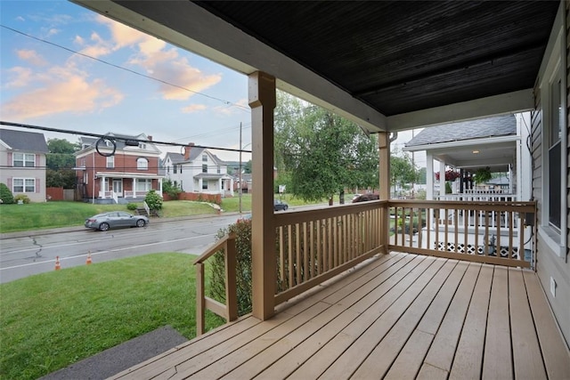 1341 4th Ave, Coraopolis, PA 15108 - wooden porch with a lawn and a residential view