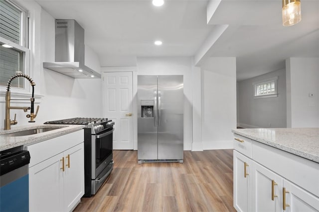 1341 4th Ave, Coraopolis, PA 15108 - kitchen featuring appliances with stainless steel finishes, wall chimney exhaust hood, white cabinetry, light stone countertops, and recessed lighting
