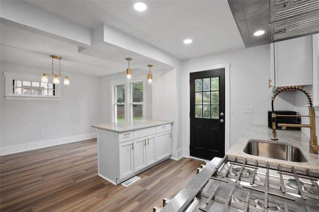 1341 4th Ave, Coraopolis, PA 15108 - kitchen with dark wood-style floors, light stone countertops, white cabinets, pendant lighting, and recessed lighting