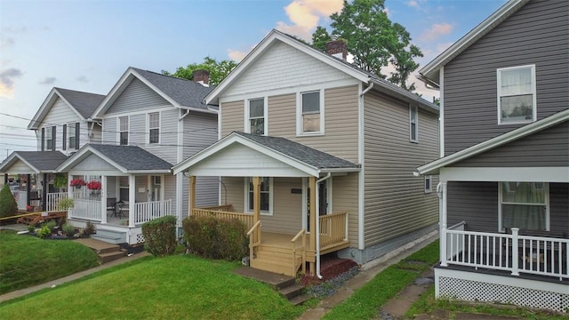 1341 4th Ave, Coraopolis, PA 15108 - view of front of property featuring a porch and a front yard