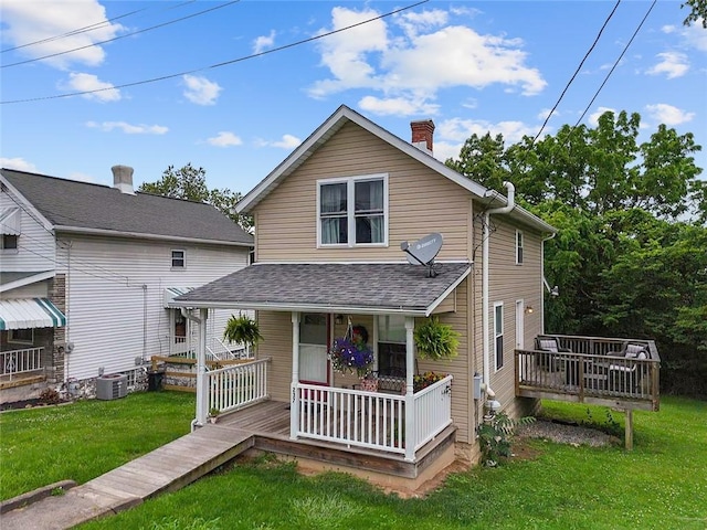 237 Prichard Ave, Centerville, PA 15358 - back of property with covered porch, a lawn, a chimney, and roof with shingles