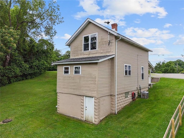 237 Prichard Ave, Centerville, PA 15358 - rear view of house featuring a yard, a garage, and a chimney