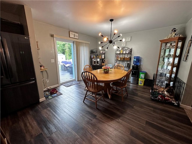 dining room featuring a chandelier and wood finished floors