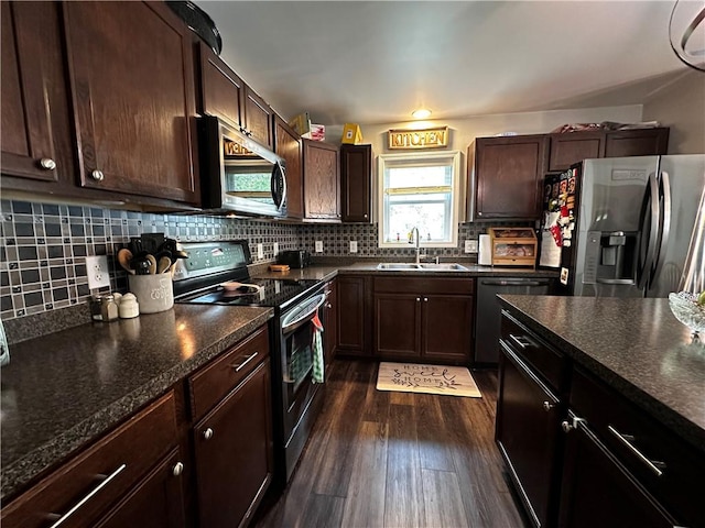 kitchen featuring appliances with stainless steel finishes, dark wood-type flooring, dark brown cabinetry, and tasteful backsplash