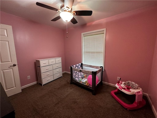 carpeted bedroom featuring a ceiling fan and baseboards