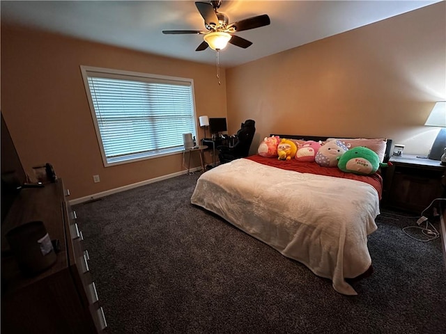 carpeted bedroom featuring a desk and a ceiling fan