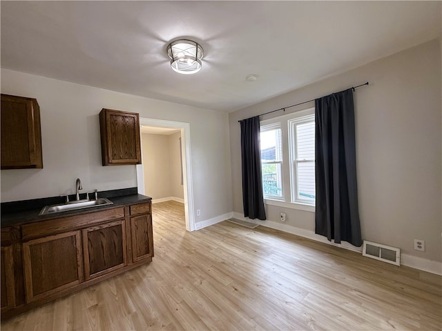 648 Jack St, City Of Greensburg, PA 15601 - kitchen featuring dark countertops and light wood-type flooring