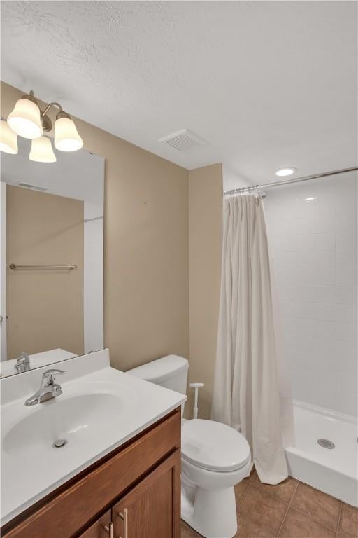 2278 Flint Dr, South Strabane, PA 15301 - bathroom with vanity, tile patterned flooring, and tiled shower