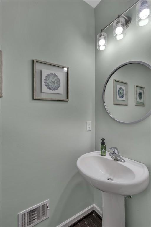 2278 Flint Dr, South Strabane, PA 15301 - bathroom featuring baseboards and wood finished floors