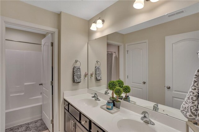 2278 Flint Dr, South Strabane, PA 15301 - bathroom with double vanity and shower / bathtub combination