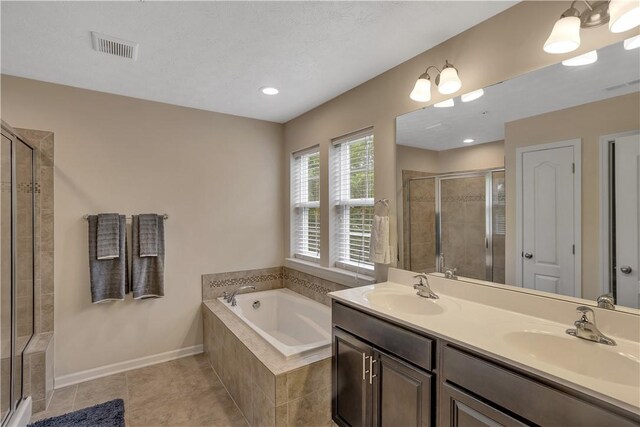 2278 Flint Dr, South Strabane, PA 15301 - full bathroom with a stall shower, a garden tub, double vanity, and tile patterned flooring