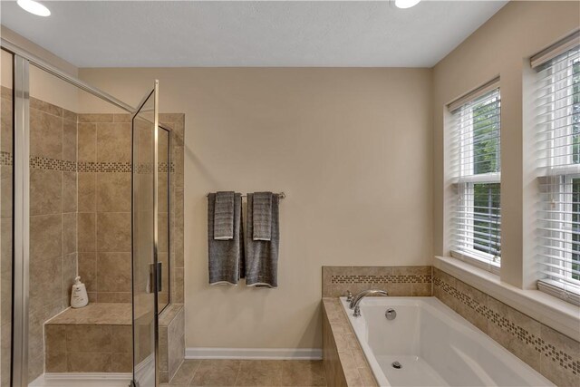 2278 Flint Dr, South Strabane, PA 15301 - full bathroom with a bath, a stall shower, tile patterned flooring, and recessed lighting