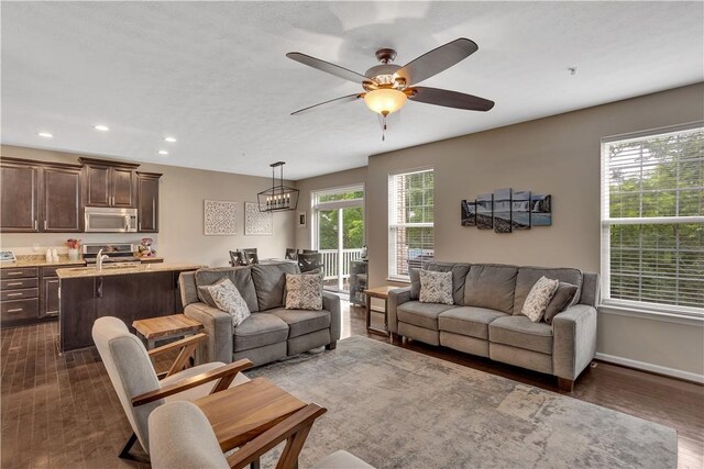 2278 Flint Dr, South Strabane, PA 15301 - living area featuring dark wood finished floors, recessed lighting, a ceiling fan, and a chandelier