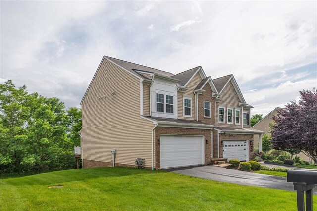 2278 Flint Dr, South Strabane, PA 15301 - view of front facade with a front lawn, an attached garage, brick siding, and asphalt driveway