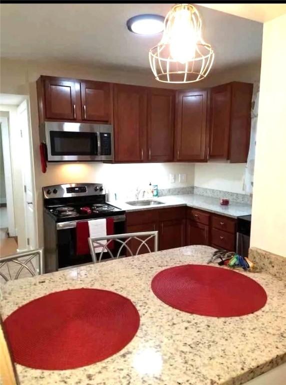 2807 Middle Rd, Hampton, PA 15116 - kitchen with appliances with stainless steel finishes and light stone counters