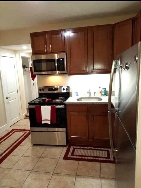 2807 Middle Rd, Hampton, PA 15116 - kitchen featuring appliances with stainless steel finishes, light tile patterned floors, and light countertops