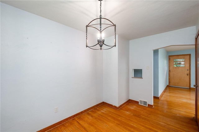1833 Allison Ave, Mccandless, PA 15101 - empty room with a chandelier and light wood-type flooring