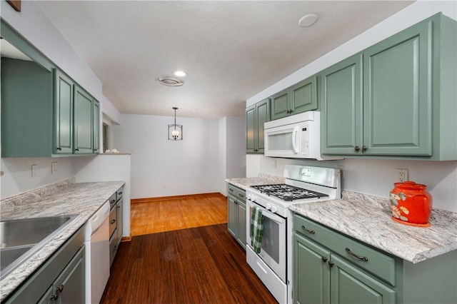 1833 Allison Ave, Mccandless, PA 15101 - kitchen featuring white appliances, green cabinetry, dark wood finished floors, light countertops, and pendant lighting