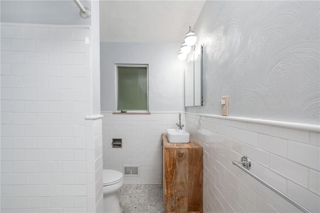 1833 Allison Ave, Mccandless, PA 15101 - bathroom with vanity, tile walls, a wainscoted wall, and tile patterned flooring