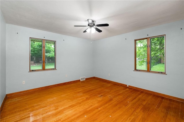 1833 Allison Ave, Mccandless, PA 15101 - empty room featuring plenty of natural light, light wood finished floors, and a ceiling fan