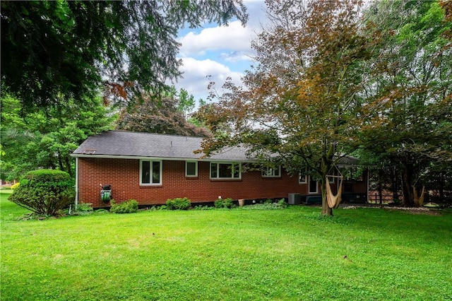 1833 Allison Ave, Mccandless, PA 15101 - view of side of home with brick siding, a yard, and a shingled roof