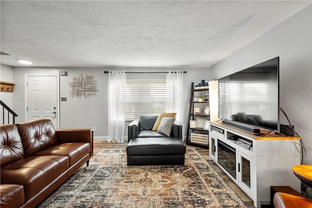 3118 Ridge Rd, South Park, PA 15129 - living area featuring wood finished floors, a textured ceiling, and stairway