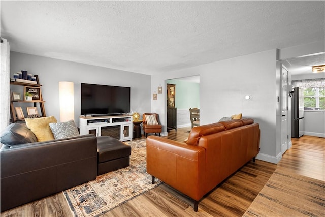 3118 Ridge Rd, South Park, PA 15129 - living area featuring a textured ceiling and wood finished floors
