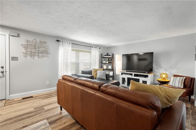 3118 Ridge Rd, South Park, PA 15129 - living room featuring light wood-type flooring and a textured ceiling
