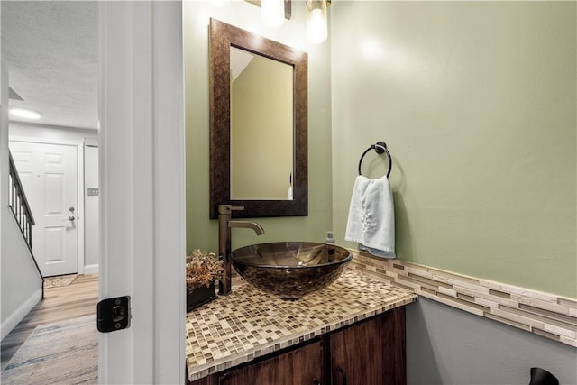 3118 Ridge Rd, South Park, PA 15129 - bathroom featuring vanity, wood finished floors, and a textured ceiling