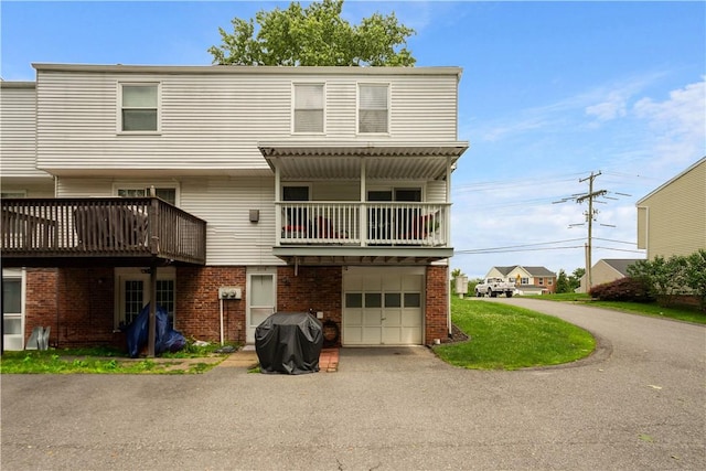 3118 Ridge Rd, South Park, PA 15129 - townhome / multi-family property featuring a garage, driveway, a balcony, and brick siding