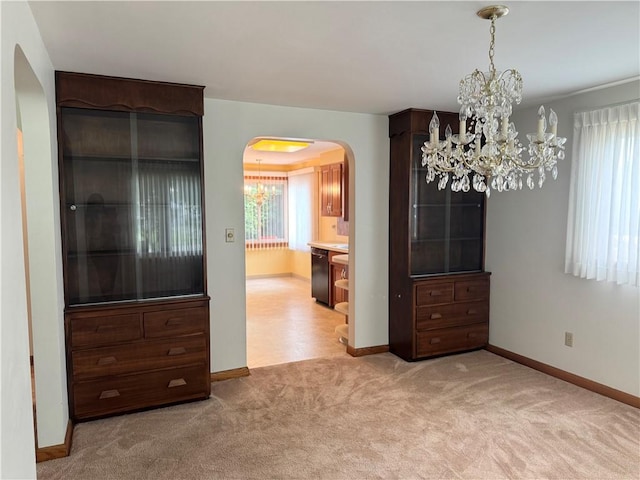 7 E Sheridan Ave, New Castle/1St, PA 16105 - carpeted dining room featuring a chandelier and arched walkways