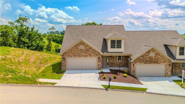 742 Sandstone Way, Rostraver, PA 15012 - view of front of home featuring concrete driveway, stone siding, and a shingled roof