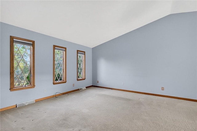 228 Bowman Rd, South Fayette, PA 15017 - spare room featuring vaulted ceiling and carpet