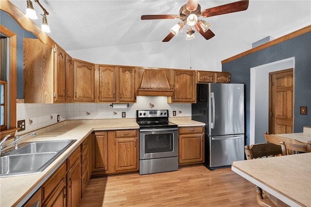 228 Bowman Rd, South Fayette, PA 15017 - kitchen with appliances with stainless steel finishes, custom exhaust hood, ceiling fan, tasteful backsplash, and vaulted ceiling