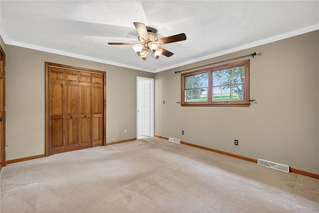 228 Bowman Rd, South Fayette, PA 15017 - unfurnished bedroom featuring crown molding, carpet, a closet, and ceiling fan