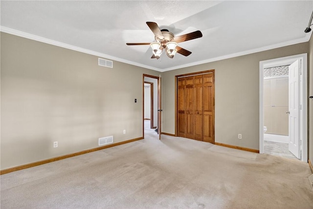 228 Bowman Rd, South Fayette, PA 15017 - unfurnished bedroom featuring light colored carpet, crown molding, ceiling fan, and connected bathroom