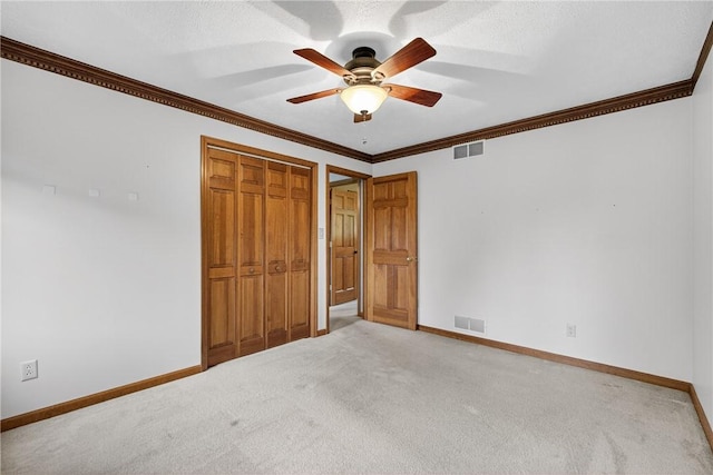 228 Bowman Rd, South Fayette, PA 15017 - unfurnished bedroom featuring light colored carpet, a closet, crown molding, and ceiling fan